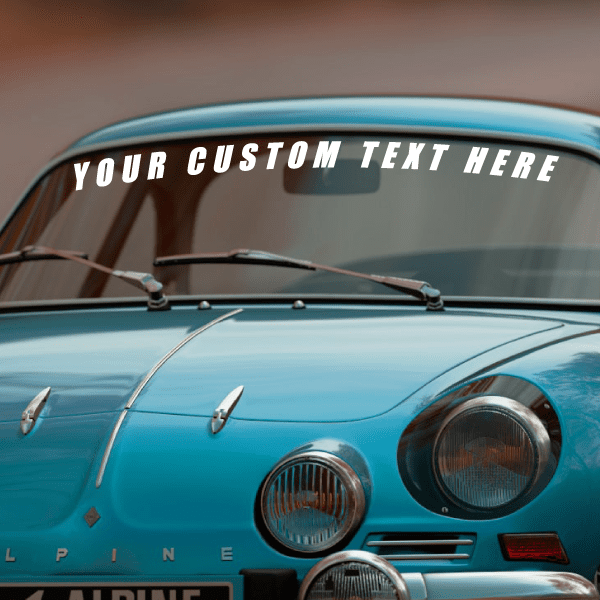 Windshield vinyl lettering decal with white uppercase text across the glass