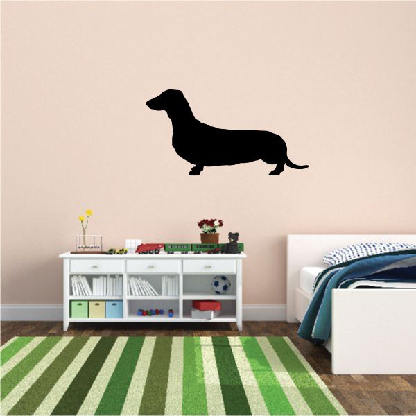 Black dachshund wall decal silhouette with tail and legs outstretched