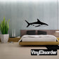 Shark wall decal featuring a black silhouette of a swimming shark.