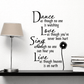 Inspirational wall decal with cursive quote and daisy flower accent