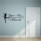 Wall decal: black ballerina silhouette and ornate quote, “Dance is Life”.