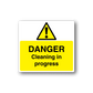 Warning sticker with yellow triangle and DANGER text: Cleaning in progress
