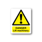 Warning sticker: yellow triangle with exclamation, 'DANGER Lift machinery'