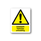 Warning sticker with yellow triangle and exclamation, text "Danger Vehicles unloading"
