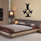 Black cross wall decal with devil face and horn details