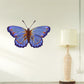 Blue butterfly wing spread wall decal with orange and yellow markings