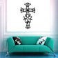 Decorated cross wall decal with black floral accents and small swirling details