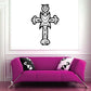 Decorative cross decal, black outlined cross with shield and bow details