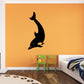 Black diving dolphin wall decal with curved fins and streamlined body