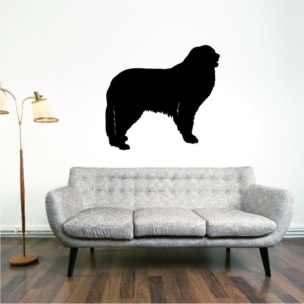 Great Pyrenees wall decal with black dog silhouette above a gray sofa
