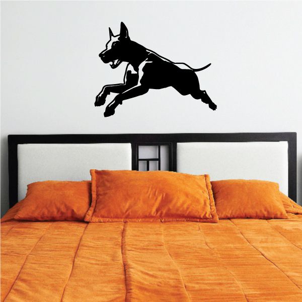 Jumping Doberman Pinscher wall decal, black silhouette with detailed fur lines.