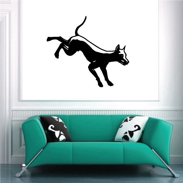 Black kicking Doberman Pinscher silhouette wall decal with detailed paws and tail.