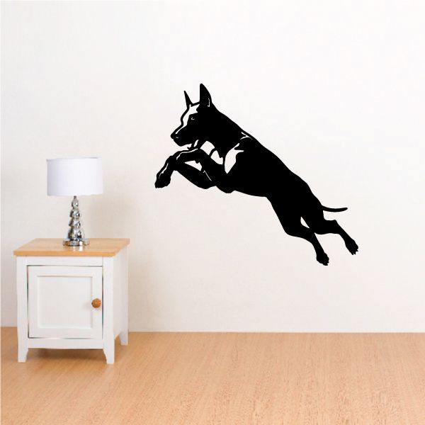 Leaping Doberman Pinscher wall decal in black, mid-jump pose