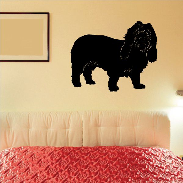 Black and tan dog silhouette decal with white outline, standing side view.