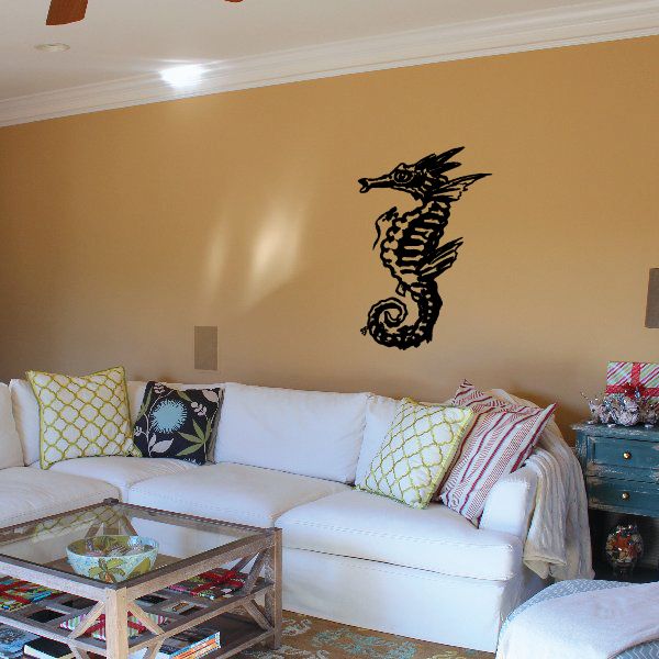 Sea horse wall decal with detailed black outline on a light surface