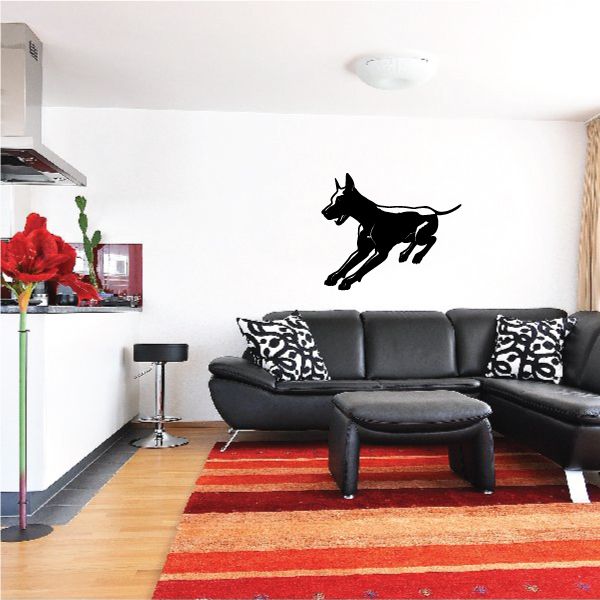 Detailed turning Doberman Pinscher wall decal, black dog silhouette in motion