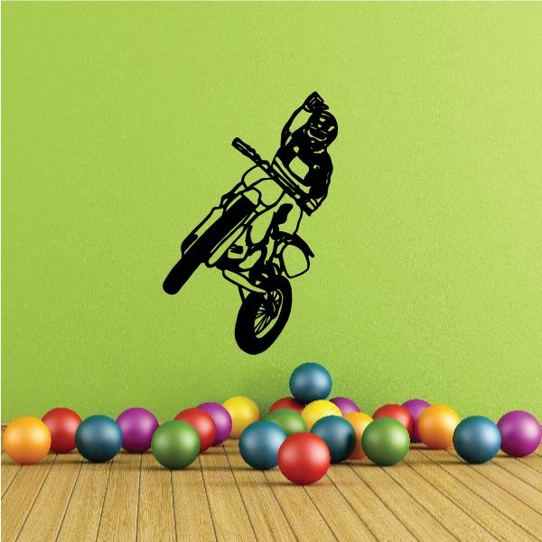 Dirt bike jump decal of a rider on a black and green motocross motorcycle