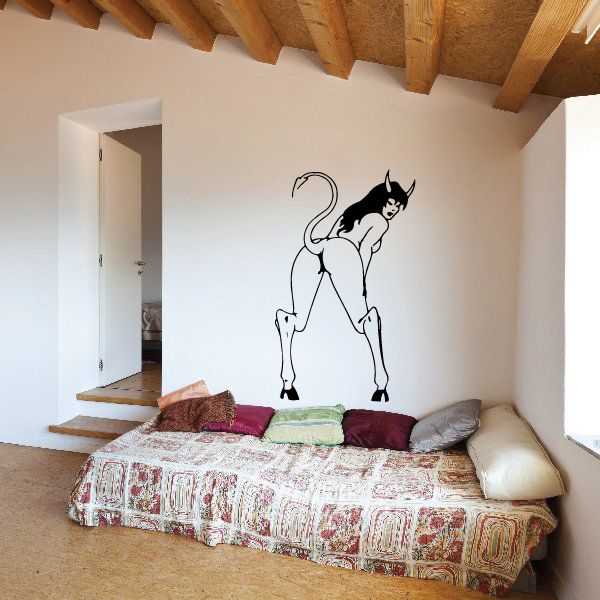 Devil girl bending over decal with black outline on a light wall