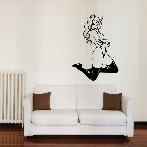 Black devil girl sitting decal with long tail and horns