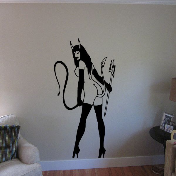 Devil girl wall decal with black outfit holding pitchfork and whip