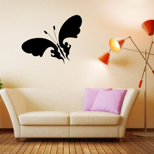 Image of Diagonal Flying Tribal Butterfly Silhoutte Decal