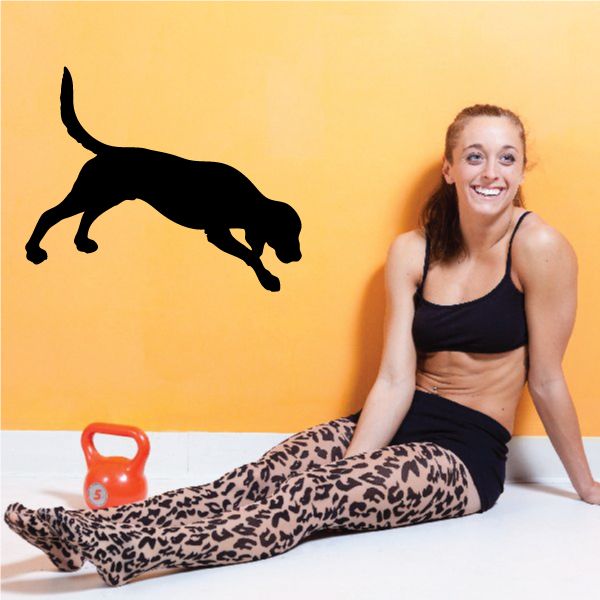 Black digging dog decal silhouette with paws-forward digging pose