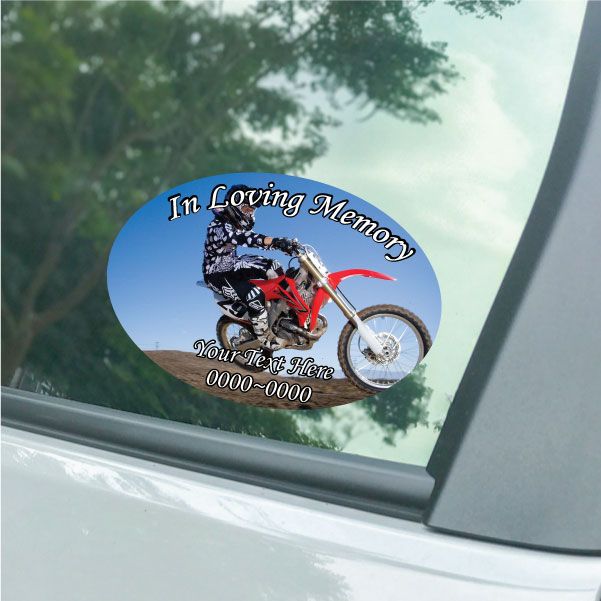 Oval dirt bike memorial sticker, blue with bike graphic and 'In Loving Memory' text