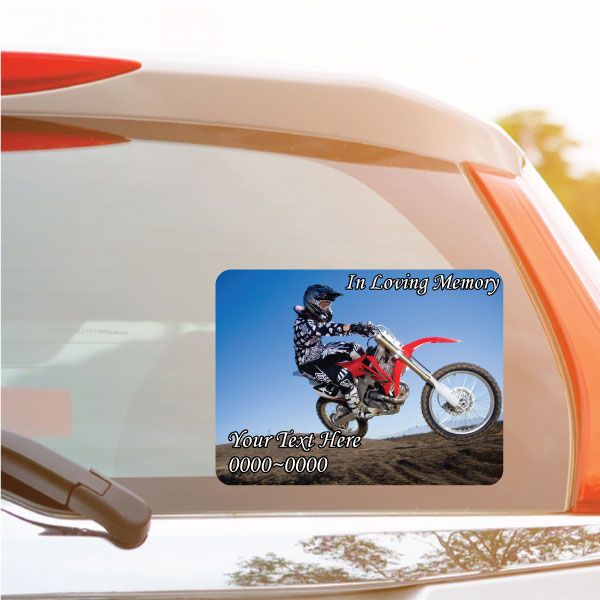 Rounded rectangle memorial dirt bike sticker with blue background and 'In Loving Memory' text
