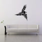 Flying eagle vinyl wall decal with sharp black feathered wings and beak