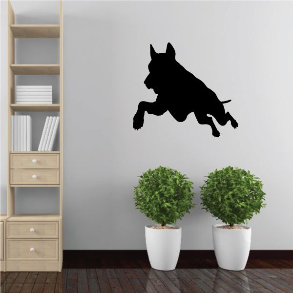 Diving Doberman Pinscher decal with black jumping dog silhouette