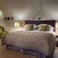 Diving dolphin ocean wall decal in black line art above bed