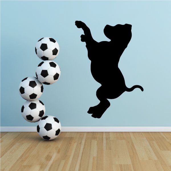 Diving puppy decal with black silhouette and six soccer ball shapes