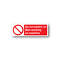 Safety sticker reading 'Do not switch on Men working on machine' with no-symbol