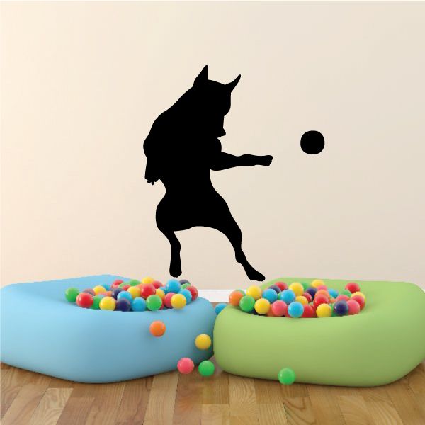 Black dog silhouette catching a ball decal