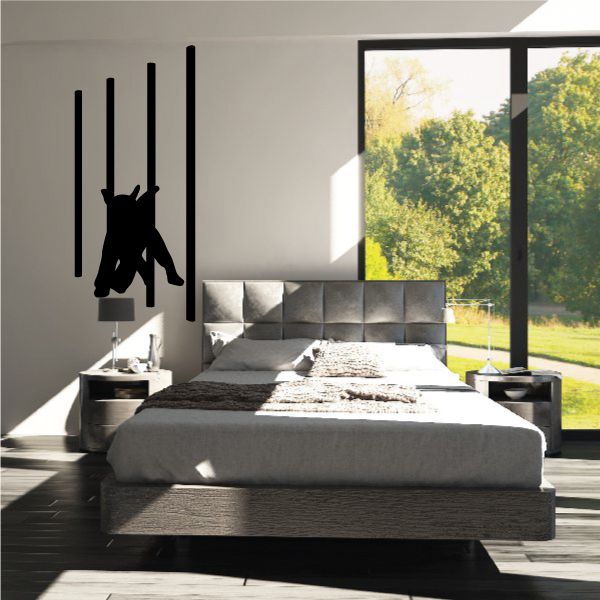 Dog running agility poles wall decal, black silhouette of dog leaping between poles.