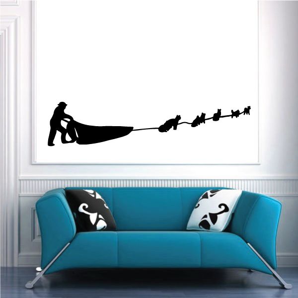 Black dog sled decal silhouette with musher and dogs on a rope line