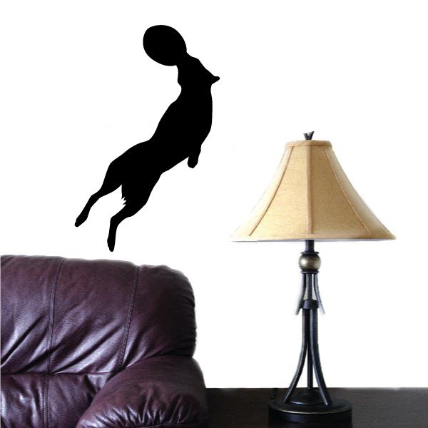 Black dog jumping with frisbee wall decal silhouette