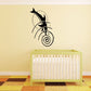 Dolphin dive moon swirl wall decal with black dolphin and spiral moon design
