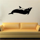 Black dolphin silhouette wall decal, curved glide pose