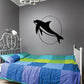 Black dolphin swimming wall decal with moon circle outline