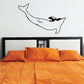 Wall decal of a black dolphin swimming sideways, outlined silhouette.