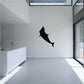 Dolphin swimming-up silhouette wall decal, black.