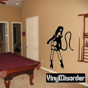 Wall decal featuring a black dominatrix silhouette holding a whip