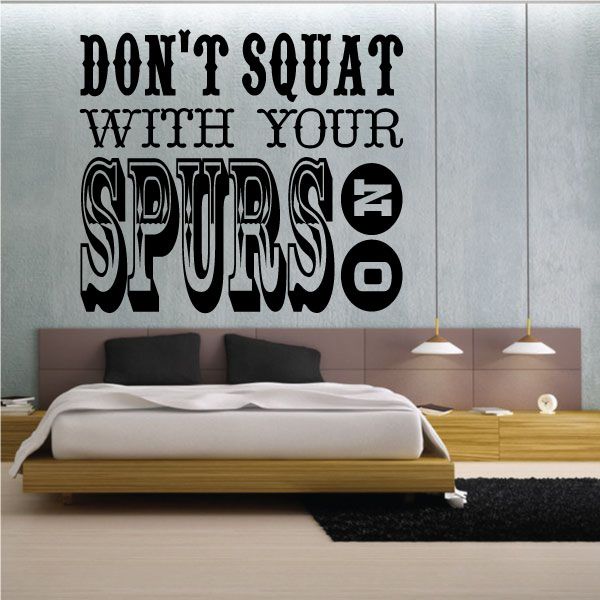 Wall decal quote "DON'T SQUAT WITH YOUR SPURS ON" in bold black lettering