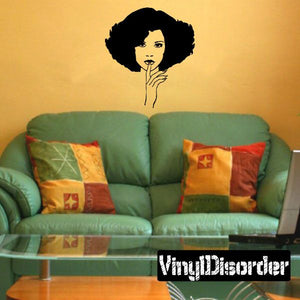 Wall decal featuring a black-and-white woman face with an afro, hand under chin
