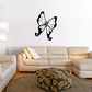 Butterfly wall decal with dotted wings and curling tails, black and white