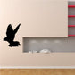 Black dove silhouette wall decal, flying bird shape.