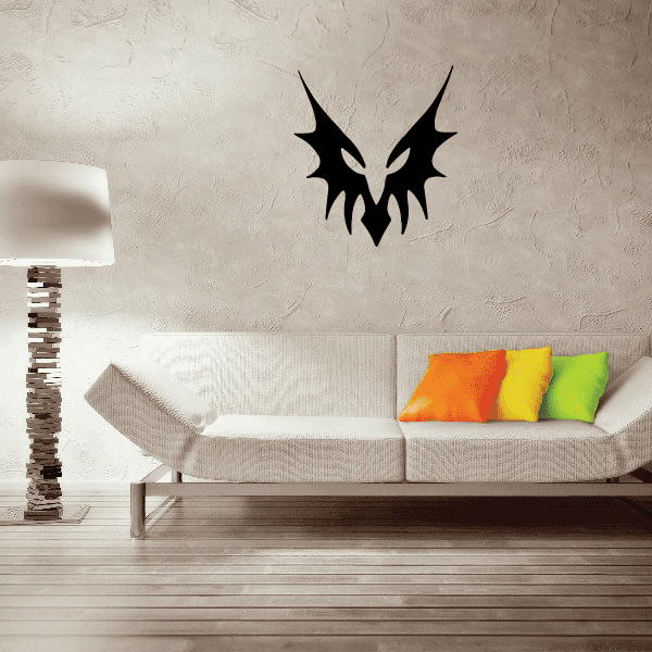 Black dragon face paint decal with fangs and pointed ears