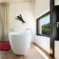 Black dragonfly wall decal with wings spread, hovering above wall