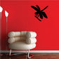 Dragonfly on stem wall decal, black insect design on a red surface